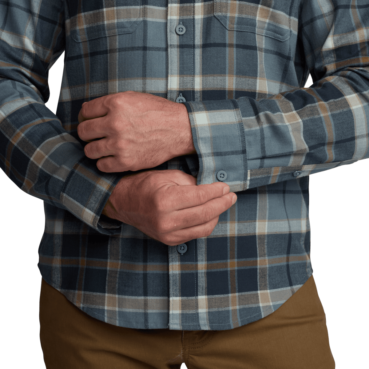 Lightweight flannel shirt cuff and placket in blue plaid, buttoned sleeve detail