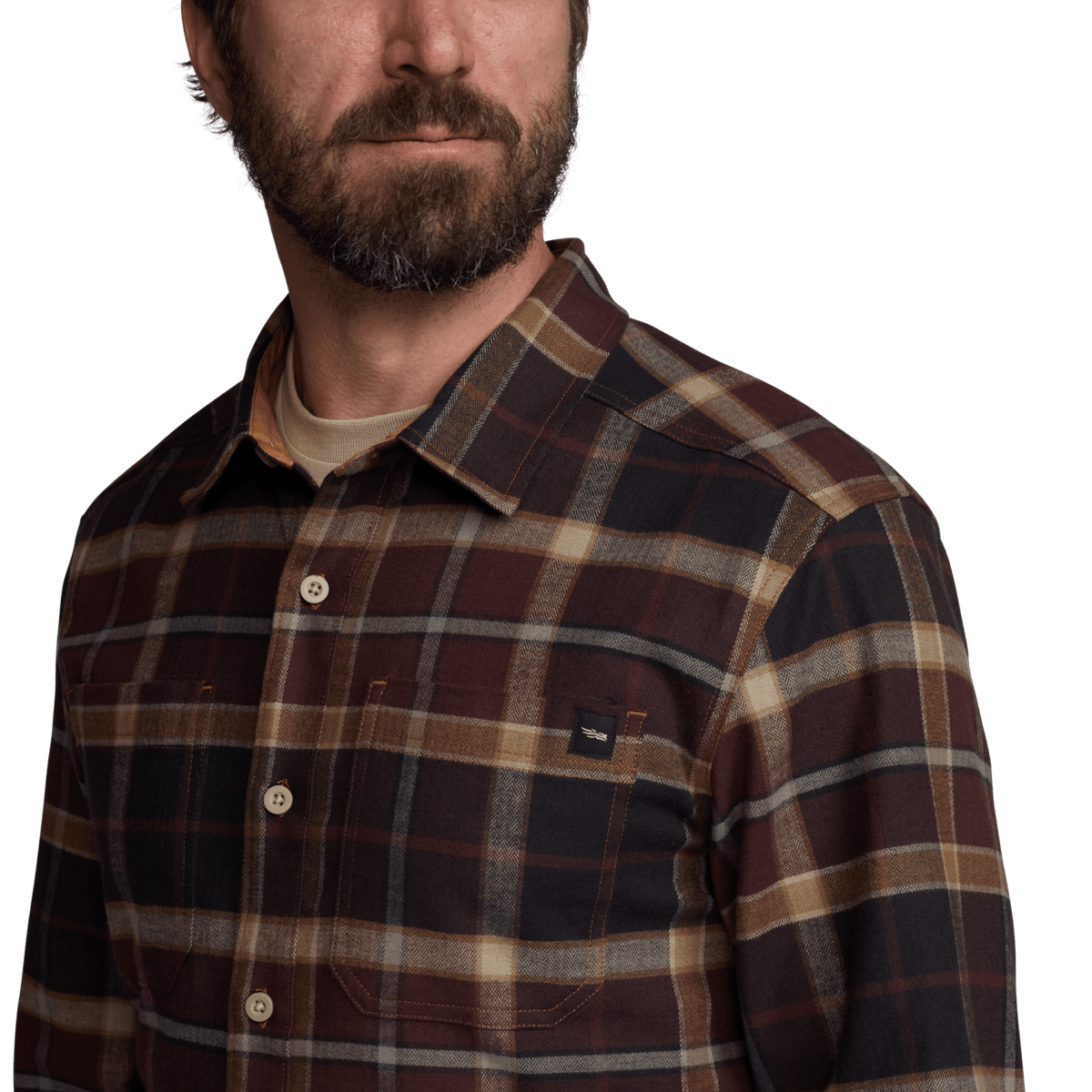 Plaid flannel shirt close-up with button front and chest pocket detail