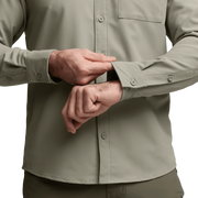 Light beige long-sleeve button-up shirt sleeve cuff and buttons close-up