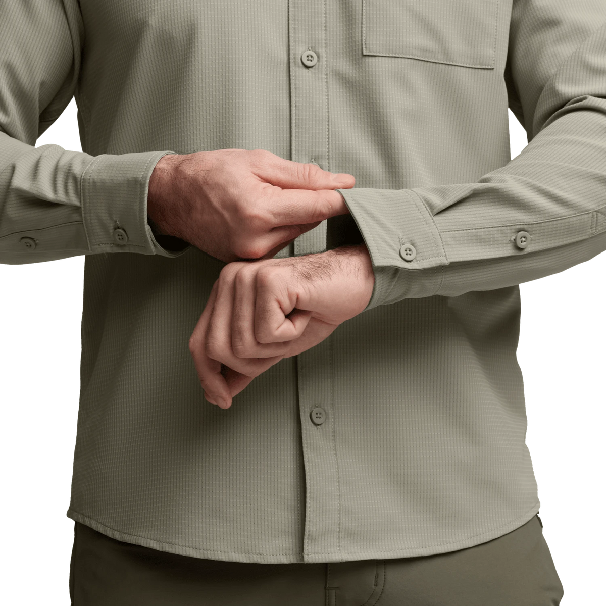 Light beige long-sleeve button-up shirt sleeve cuff and buttons close-up