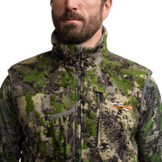 Green camo high-collar vest with full-length zipper and chest pocket detail