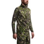 Camouflage hunting vest with full-zip front and high collar, long sleeves underneath