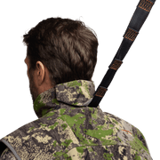 Camouflage hunting vest neckline and zipper detail, viewed from the side