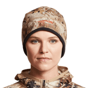 Women’s camouflage beanie worn by model, brown and tan animal-print with black cuff