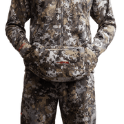 Camo insulated hand muff worn at the waist with zipper opening