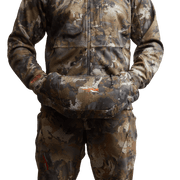 Camo insulated hand muff with front pouch, worn over matching camouflage