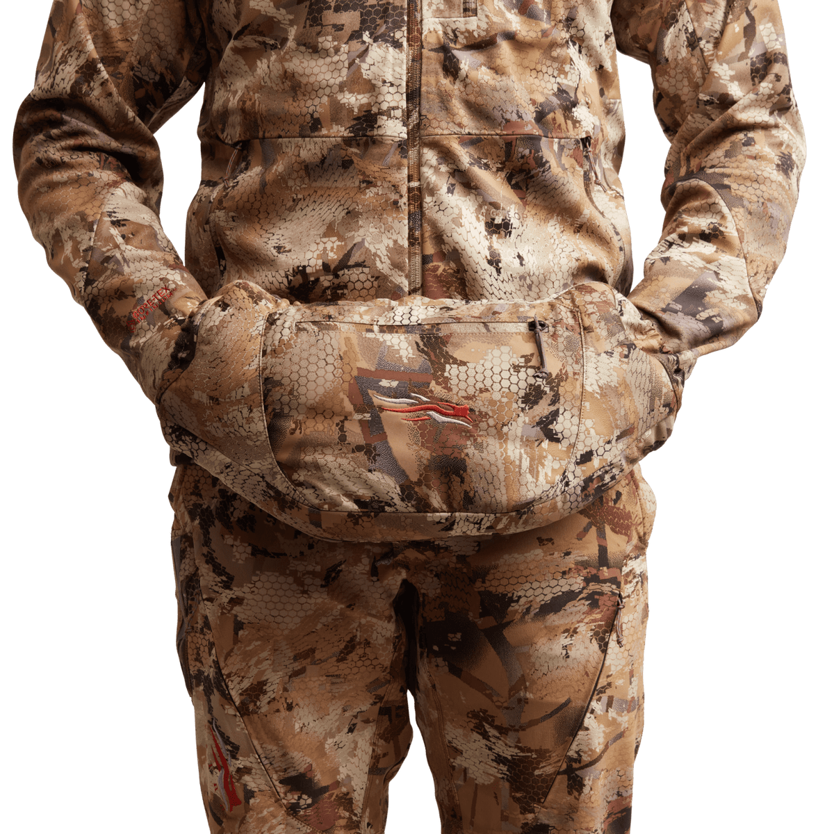 Worn camo insulated hand muff attached at the front pouch