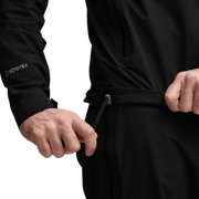 Black jacket close-up with full-zip slider and drawcord waist adjuster