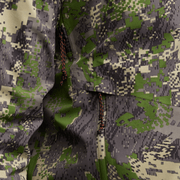 Green and gray camouflage Dew Point jacket close-up of front zipper and textured fabric.