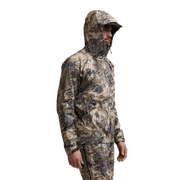 Camouflage hooded jacket worn by model, long sleeves and zip front