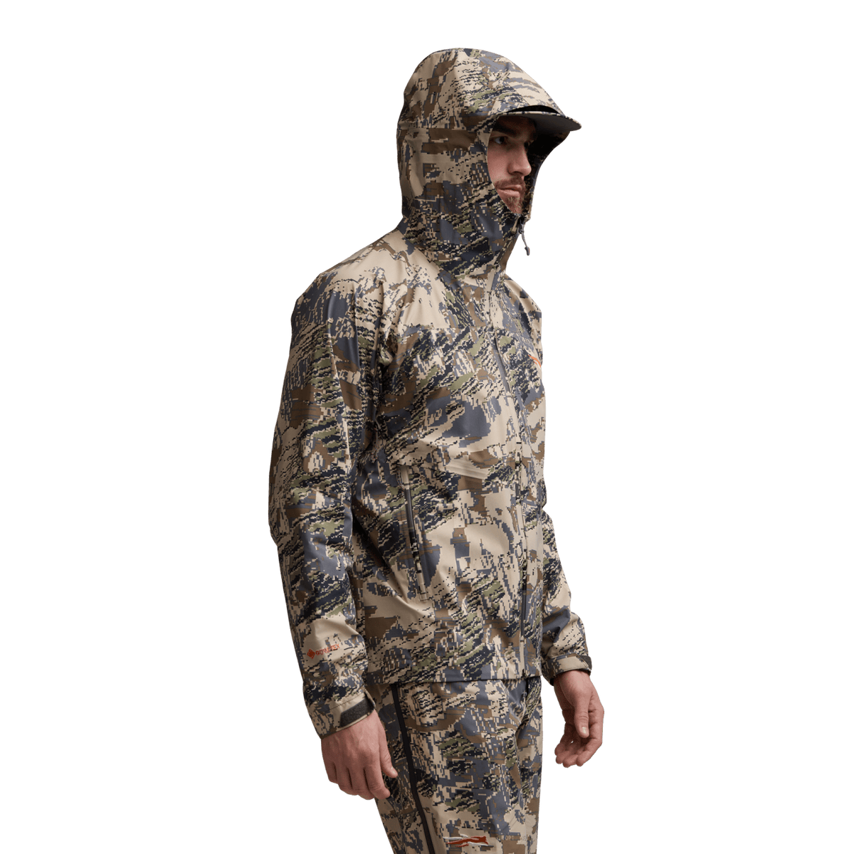 Camouflage hooded jacket worn by model, long sleeves and zip front