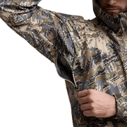 Camouflage hooded jacket close-up, front zipper and adjustable drawcord visible