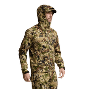 Camouflage hooded jacket with zip front and elastic cuffs, worn by model