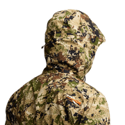 Camouflage hooded jacket with orange logo patch on shoulder