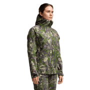 Women’s camo hooded jacket worn by model, side view