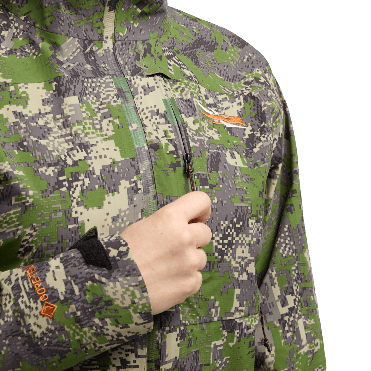 Women’s pixel camouflage jacket with front zipper and hand holding the collar area
