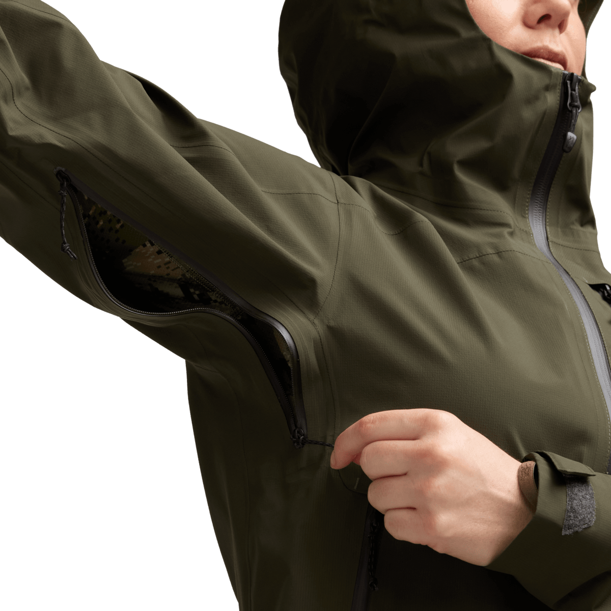 Olive jacket sleeve close-up with zip pocket and zipper pull near cuff