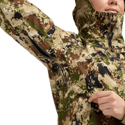 Camouflage jacket close-up with front zipper and drawcord at hood