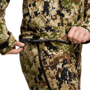 Women’s camouflage jacket close-up with front zipper and adjustable drawcord hem