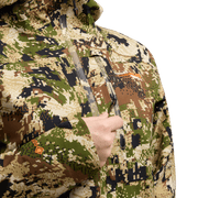 Camouflage jacket close-up with front zipper pull and logo patch