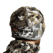 Fleece beanie hat in brown, black, and white camo with front zipper label