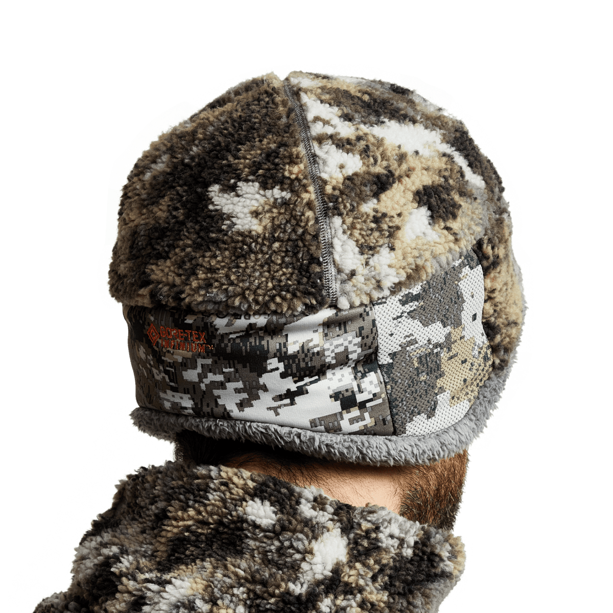 Fleece beanie hat in brown, black, and white camo with front zipper label