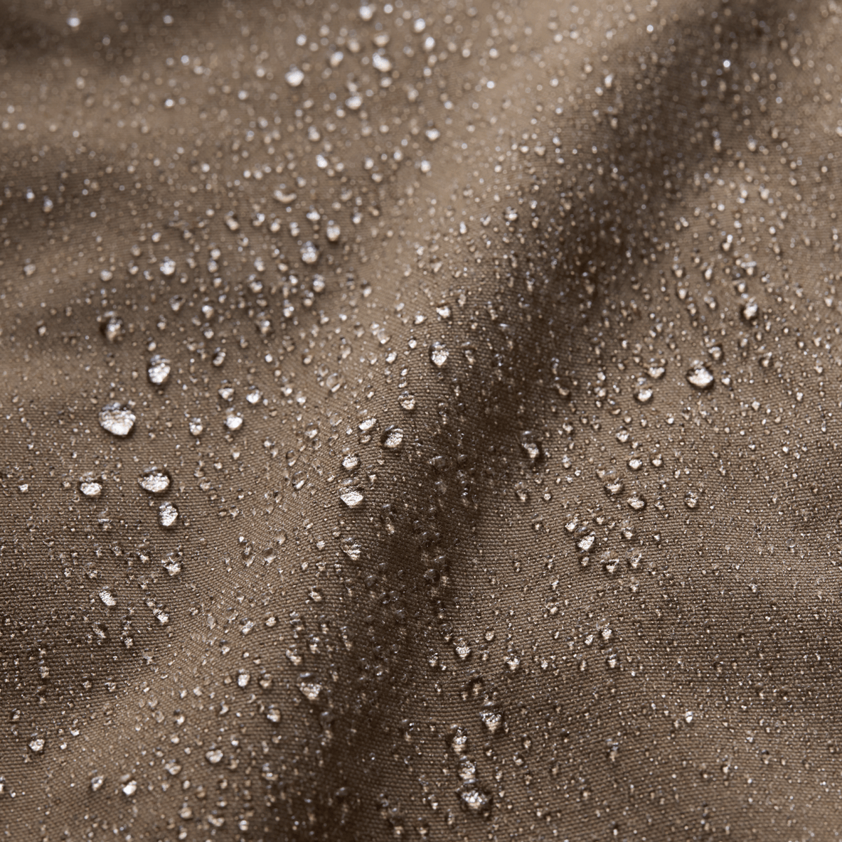 Water-beaded coyote brown coated fabric detail