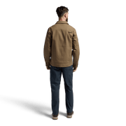 Men’s chore coat in coyote brown, back view with stand collar and buttoned placket.