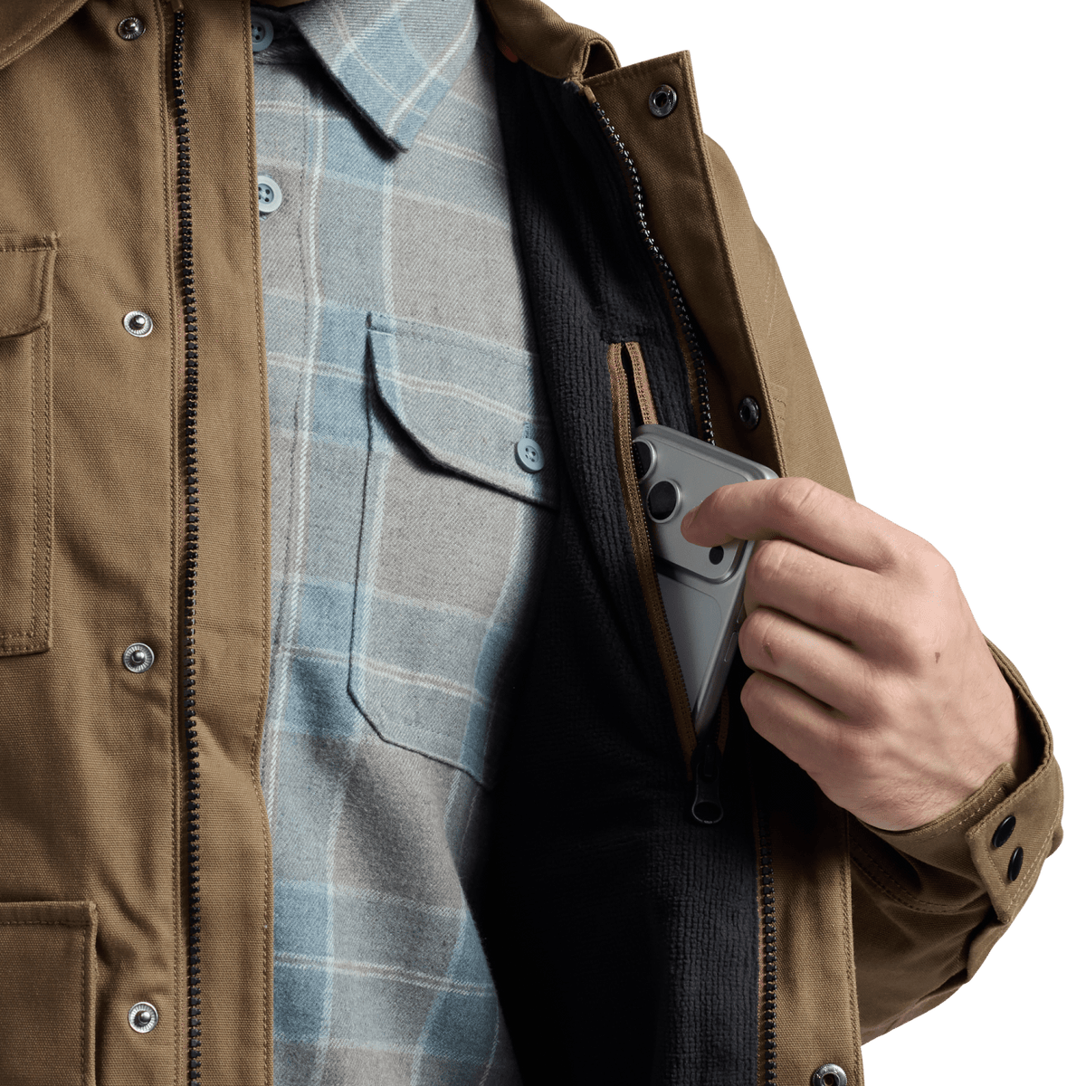 Coyote brown chore coat front detail with chest pockets and visible front zipper opening.