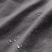 Water droplets on dark fabric texture