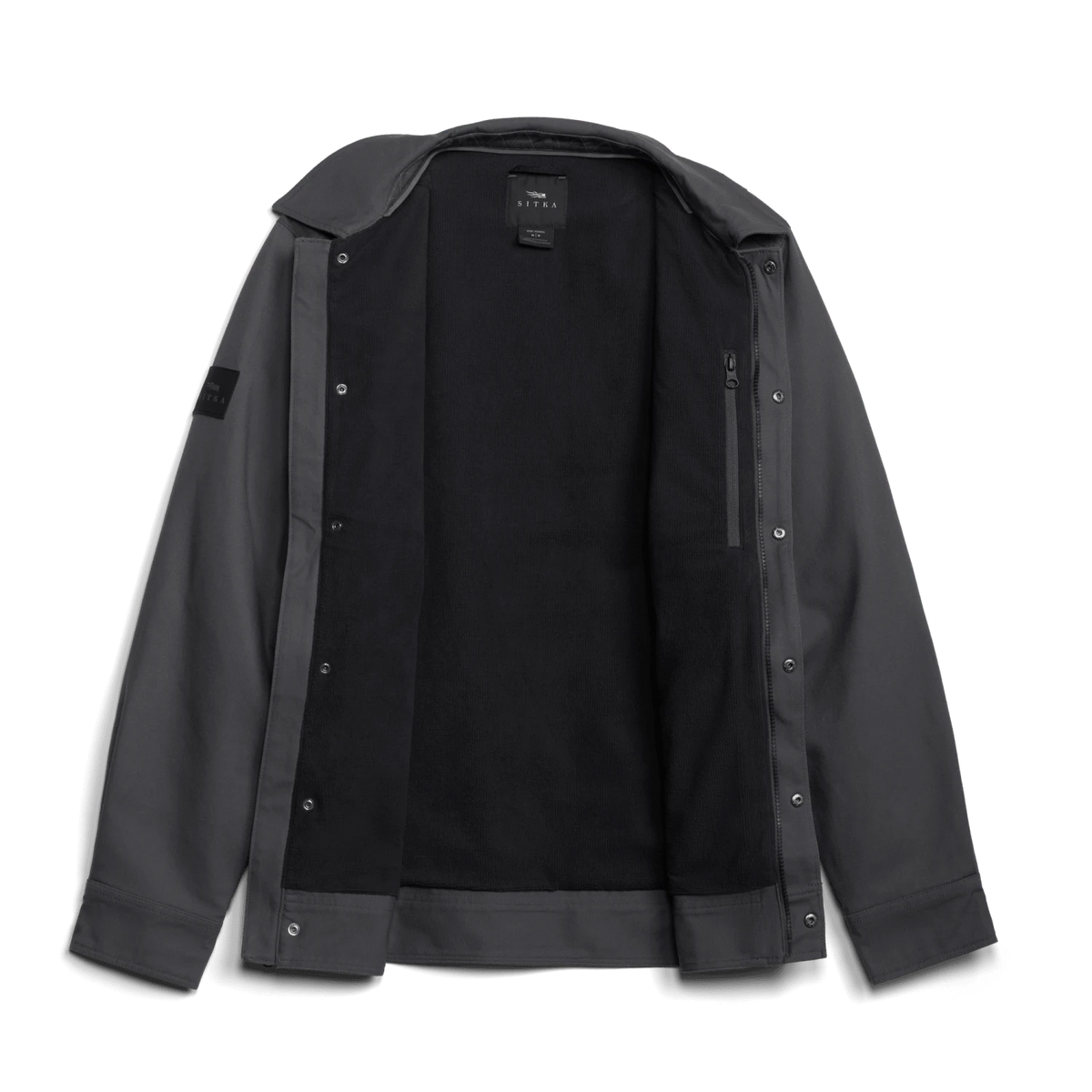 Black chore coat viewed open, showing inner lining and snap-button placket