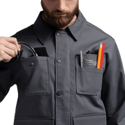 Iron grey chore coat with button front, pointed collar, and chest pocket