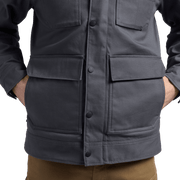 Iron grey chore coat front view with snap buttons and chest flap pockets