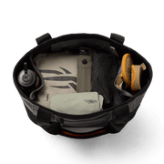 Open black 40L tote bag interior with pockets, bottle, and gear organizer