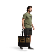 40L black tote bag carried by a man, with wide handles and side panels