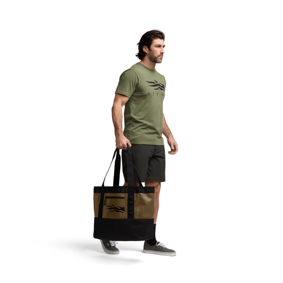 40L black tote bag carried by a man, with wide handles and side panels