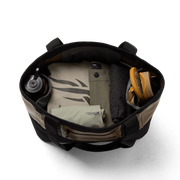 Black 40L tote bag open wide, showing interior dividers and stored items