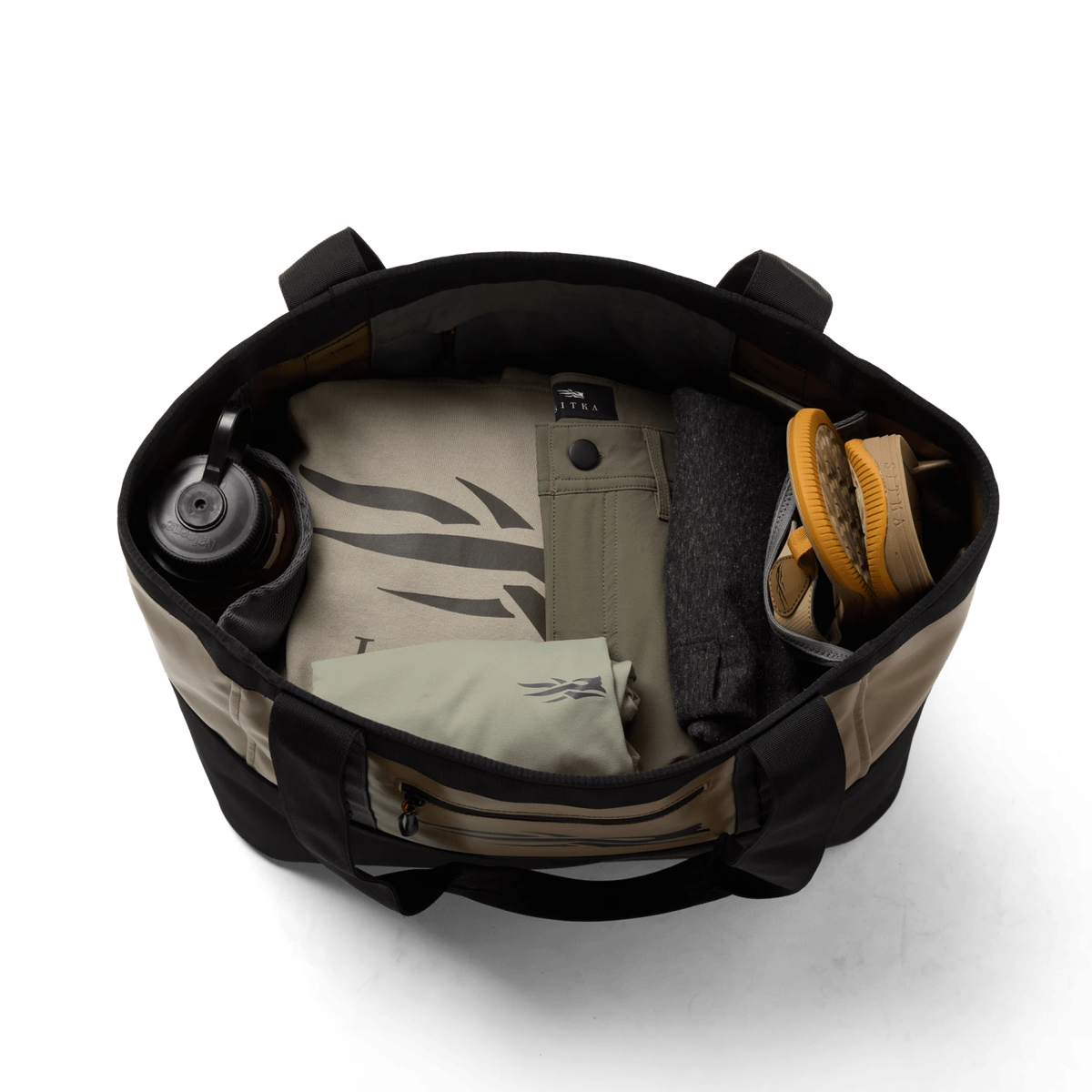 Black 40L tote bag open wide, showing interior dividers and stored items