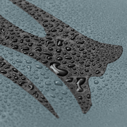 Waterproof fabric close-up with water droplets on grippy textured surface