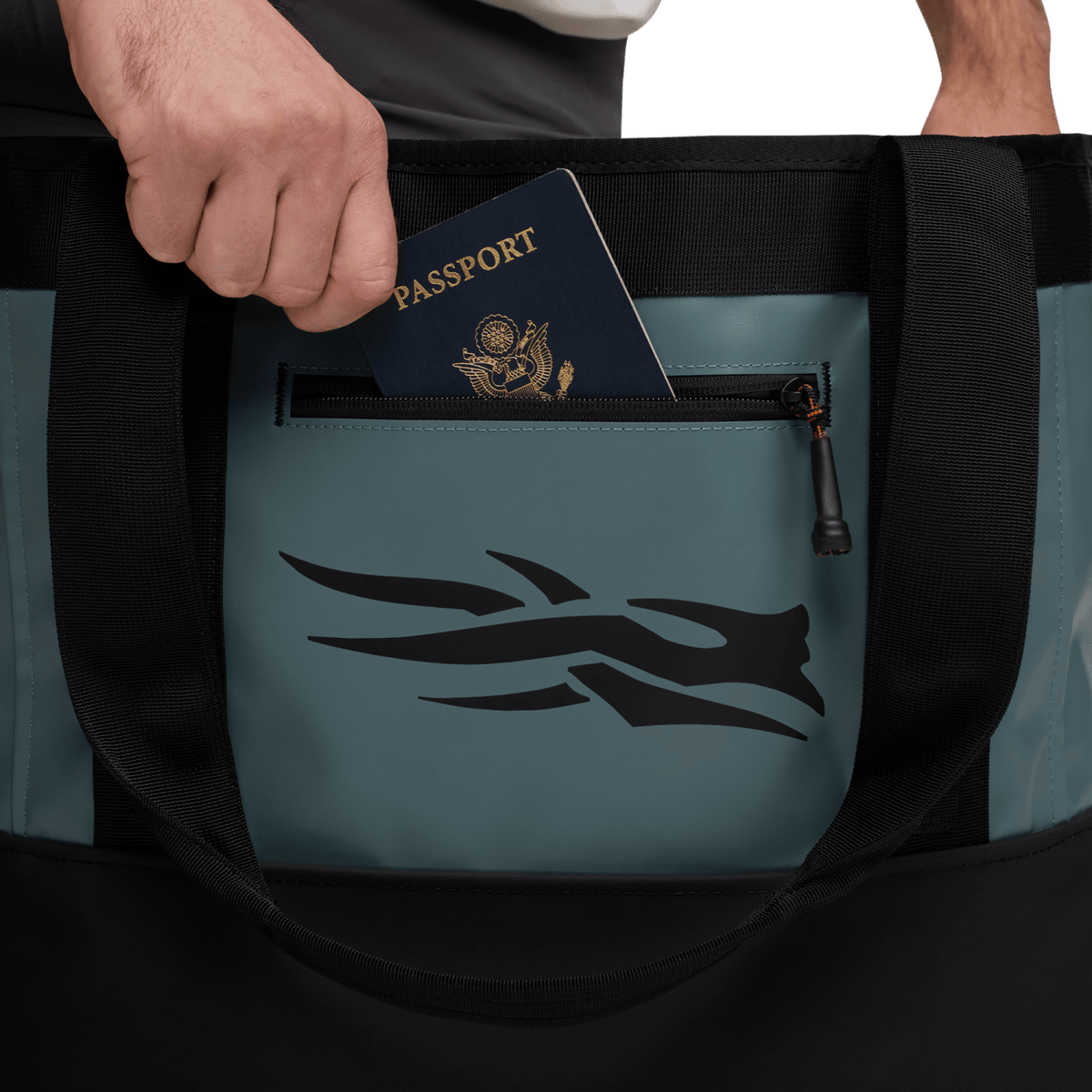 40L tote bag front pocket holding a passport, with black mesh lining and zipper