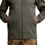 Close-up of dark green hooded fleece jacket front with zipper and side pockets