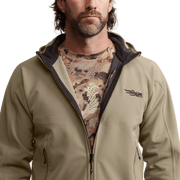 Khaki fleece hooded jacket close-up with front zipper and small chest logo