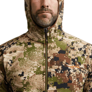 Alpha fleece hooded jacket close-up at hood and face, camouflage pattern, front zipper