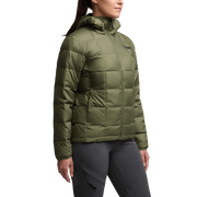 Women’s microdown hooded puffer jacket in olive green, side view, quilted panel seams