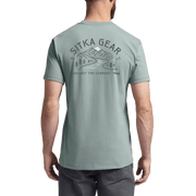 Seafoam crew-neck pocket t-shirt worn, back graphic print visible