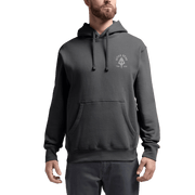 Dark gray pullover hoodie on model, with hood, drawstring, and chest logo