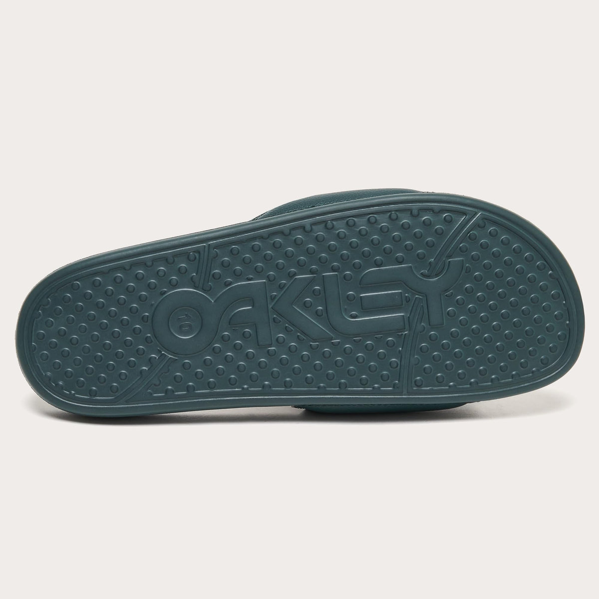 Teal slide sandal outsole with textured tread and raised logo details