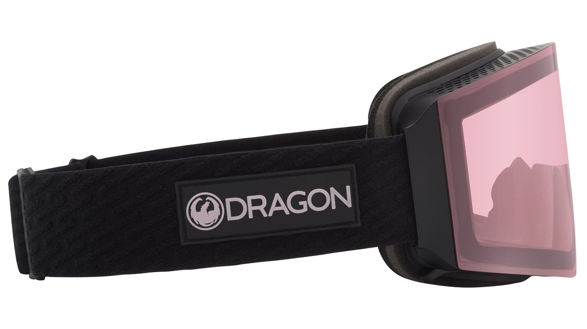 Snow goggles with pink/mauve mirrored lens and black strap, side angle view