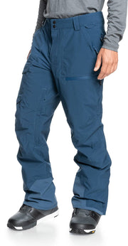 Men's blue snowboard pants side view with cargo flap pockets and cuff straps