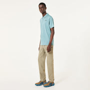 Men's light blue polo shirt worn by model, short sleeves and chest logo